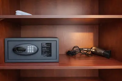 a microwave on a wooden shelf with a radio at 1BR in Dubai Marina with Marina Skyline Views in Dubai