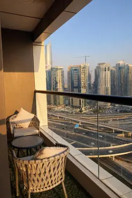 a balcony with a view of a city skyline at 1BR in Dubai Marina with Marina Skyline Views in Dubai