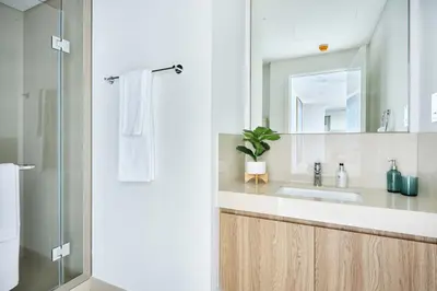 a bathroom with a sink and a mirror at Frank Porter - Downtown Views II in Dubai