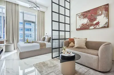 a living room with a couch and a table at Frank Porter - J One Tower, Business Bay in Dubai