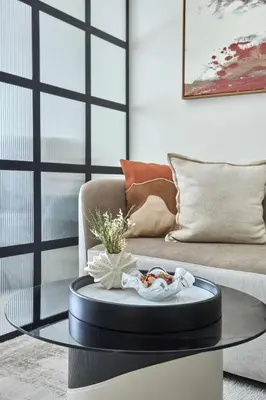a coffee table in a living room with a couch at Frank Porter - J One Tower, Business Bay in Dubai