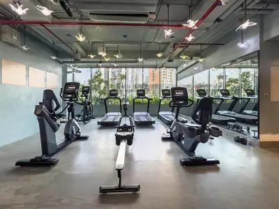 a gym with several treadms and cardio machines at Panoramic View Dubai Mall 8 min walk Infinity pool in Dubai
