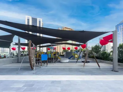 a black canopy with chairs and tables on a patio at Panoramic View Dubai Mall 8 min walk Infinity pool in Dubai