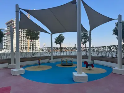 a playground with a tent on a roof at Stylish Studio near Downtown with pool in Dubai