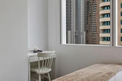 a bedroom with a desk and a chair and a window at Stunning 2 Bedroom Apartment in Dubai Marina in Dubai