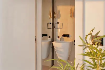 a bathroom with a toilet and a sink at Stunning 2 Bedroom Apartment in Dubai Marina in Dubai