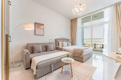 a living room with a couch and a bed at High-Floor Studio with Views of Miracle Garden and Community, Near Dubai Top Attractions, Skyz by Danube, Arjan by Deluxe Holiday Homes in Dubai