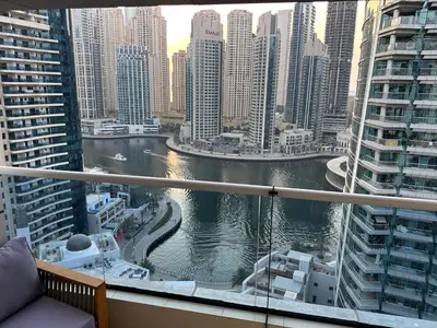 a view of a river in a city with tall buildings at Premium 2BR Marina View Apartment in Dubai Marina in Dubai