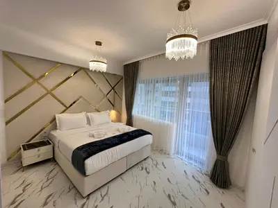 a bedroom with a bed and a large window at Premium 2BR Marina View Apartment in Dubai Marina in Dubai