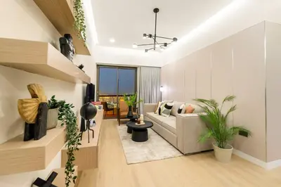 a living room with a couch and some plants at FIRST CLASS 2BR Sea, Palm & Atlantis Views in Dubai