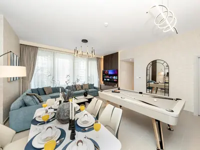a living room with a pool table and a couch at Royal Vista25 - 4BR with Billiard Table at Forte Tower Downtown Dubai in Dubai