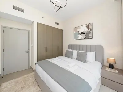 a bedroom with a large white bed in a room at Royal Vista25 - 4BR with Billiard Table at Forte Tower Downtown Dubai in Dubai