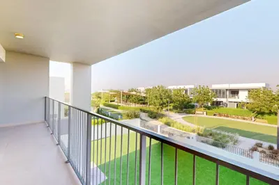 an apartment balcony with a view of a tennis court at Vacationer l Incredible 5 Bed l Private Garden l near Mall in Dubai