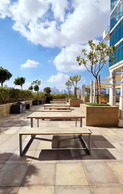 a row of picnic tables on a patio at Modern Deluxe Studio in Dubai in Dubai