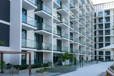 an exterior view of a building with balconies at Binghatti Phoenix Luxe 1BR with Tranquil Pool View in Dubai