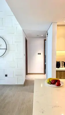 a plate of fruit on the floor of a kitchen at Stylish 2 Bed with full marina view on high floor in Dubai