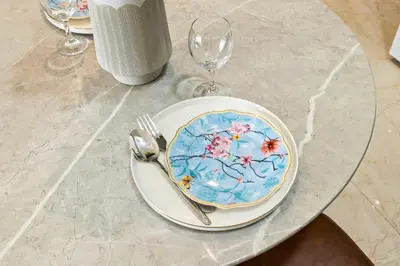 a table with a plate and a fork and knife at BLVD Modern Stay in Jewelz -Balcony Pool & Gym in Dubai
