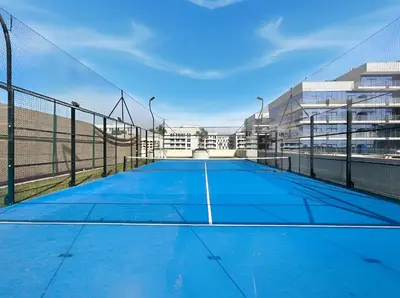 a tennis court on top of a building at BLVD Modern Stay in Jewelz -Balcony Pool & Gym in Dubai