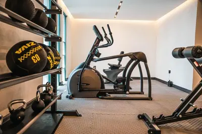 a room with a gym with a treadmill at 1BDR Large Living Room Nearby Metro in Dubai