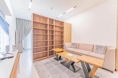 a living room with a couch and a table at HAVN - Studio in Binghatti Dawn, JVC in Dubai