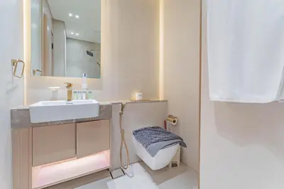a bathroom with a sink and a mirror at HAVN - Studio in Binghatti Dawn, JVC in Dubai