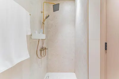 a bathroom with a shower with a shower head at HAVN - Studio in Binghatti Dawn, JVC in Dubai