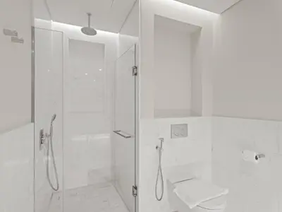 a white bathroom with a shower and a toilet at Sunset Bliss Elegant Palm Island Studio in Dubai