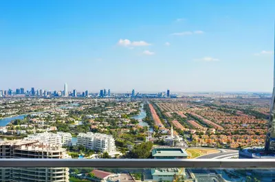 an aerial view of a city with a river and buildings at Spacious 3BR and Study with Multiple Ensuites Medore Residence in Dubai