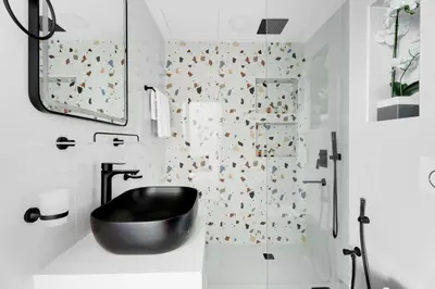 a bathroom with a black sink and a shower at GuestReady - 3BR | Luxury High-Rise Escape in Dubai