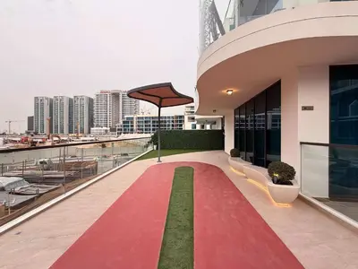 a balcony of a building with a red carpet at Luxury 1BR with Private Pool & Balcony in Dubai