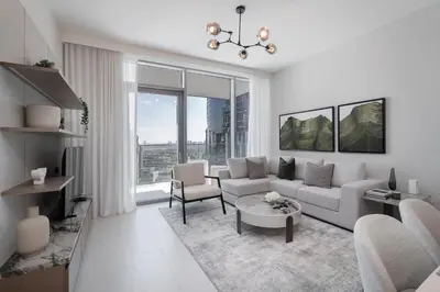a living room with a couch and a table at Elegant 1BR LIV Marina Dubai World-Class Amenities in Dubai