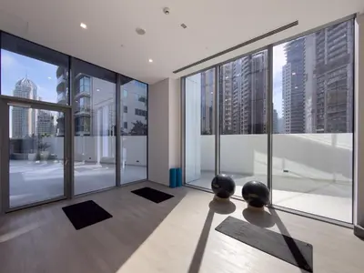 a yoga room with a view of the city at Elegant 1BR LIV Marina Dubai World-Class Amenities in Dubai
