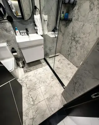 a bathroom with a sink and a toilet and a shower at Modern Studio in Opalz - Ideal for Work & Leisure in Dubai