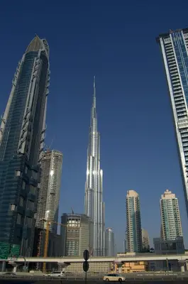 a group of tall buildings in a city at Luxury Apartments Near Burj Khalifa in Downtown in Dubai
