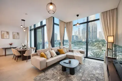 a living room with a couch and a table at Luxury Apartments Near Burj Khalifa in Downtown in Dubai