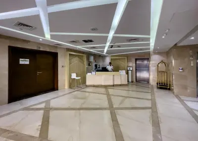 a lobby with a reception desk in a building at HAVN - Studio in Botanica, JVC in Dubai