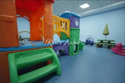a childrens play room with a toy train at Lovely beach life 1 bed apartment in Dubai Marina in Dubai