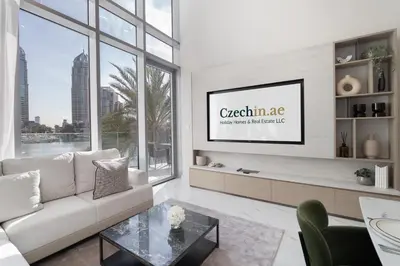 a living room with a couch and a tv at Luxury 2BR LIV Marina Dubai World-Class Amenities in Dubai