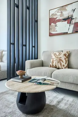 a living room with a couch and a coffee table at Frank Porter - J One Tower in Dubai