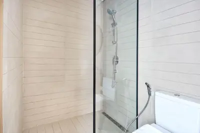 a shower with a glass door in a bathroom at Frank Porter - Peninsula One in Dubai
