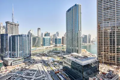 an aerial view of a city with tall buildings at Frank Porter - Peninsula One in Dubai
