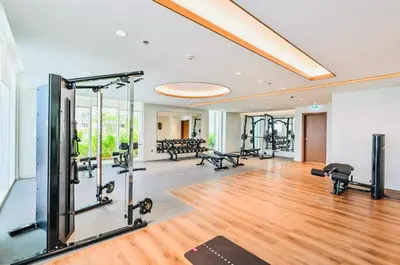 a gym with treadmills and cardio equipment in a room at Luxury Sea View 1BR l Palace Beach Residence in Dubai