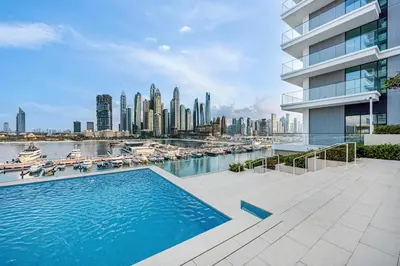 a swimming pool with a view of a city at Beachfront stay at Beach Mansion with Private Beach in Dubai