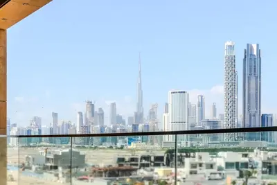 a view of a city skyline from a window at TRPS - Azizi Riviera 5, Al Meydan - Modern Luxury 1BR, Minutes to Burj Khalifa in Dubai