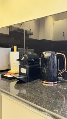 a toaster sitting on a counter in a kitchen at Studio Centrally Located Near to Metro in Dubai