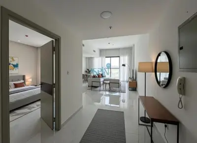 a living room with a bed and a mirror at Modern 1BHK Equiti Arcade- Al Furjan -Near Metro in Dubai