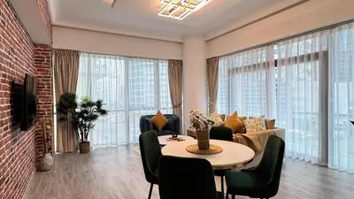 a living room with a table and a couch at 1 Bedroom Centrally located near the Metro in Dubai
