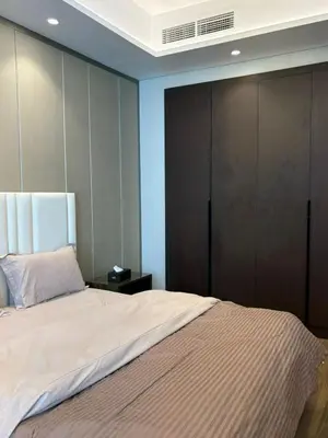 a bedroom with a large bed with a brown closet at Stylish 2BR in Business Bay with all essentials in Dubai