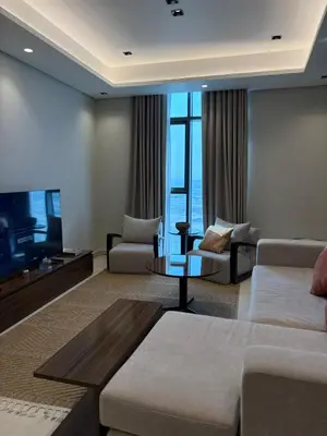 a living room with a couch and a tv at Stylish 2BR in Business Bay with all essentials in Dubai