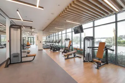 a gym with treadmills and cardio equipment in a building at Bright 1BR in Executive Residences 2, Dubai Hills in Dubai
